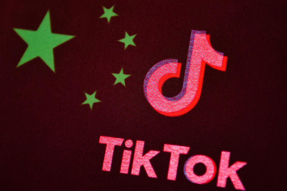 In this photo illustration a TikTok logo is seen displayed on a smartphone with a Chinese flag on the background.  Photo: Getty