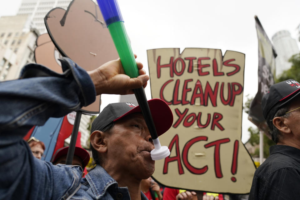 Hotel workers march to demand better wages Wednesday, Oct. 25, 2023, in Los Angeles. (AP Photo/Ryan Sun)