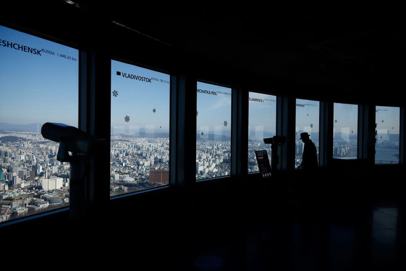 A man enjoys the view from the top of N Seoul Tower amid the coronavirus disease (COVID-19) pandemic in Seoul