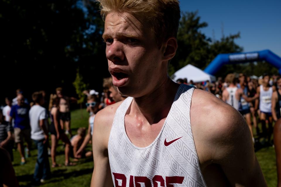 Runners recover after the championship boys race at the Border Wars XC meet at Sugar House Park in Salt Lake City on Saturday, Sept. 16, 2023. | Spenser Heaps, Deseret News