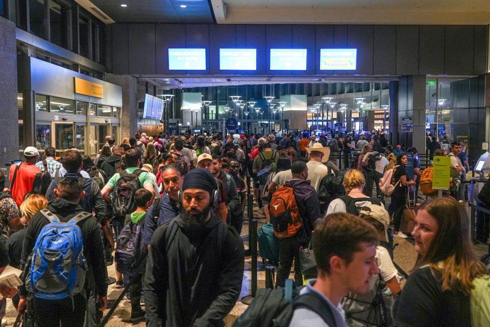 Security lines get backed up as travelers flock to Austin-Bergstrom International Airport on Thursday, June 29, 2023 in Austin.