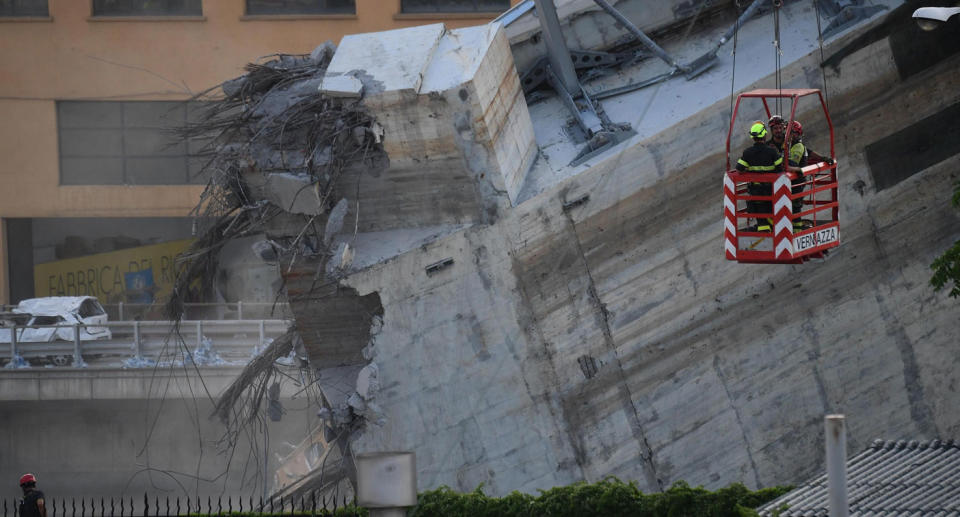 A rubble fire delayed recovery efforts at the Genoa bridge collapse site on Friday. Source: AAP