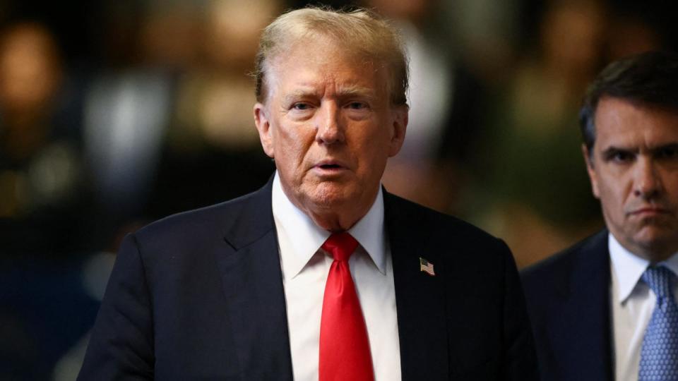 PHOTO: Former President Donald Trump speaks to the media with his attorney Todd Blanche during his criminal trial for allegedly covering up hush money payments at Manhattan Criminal Court in New York City, May 28, 2024. (Andrew Kelly/POOL/AFP via Getty Images)