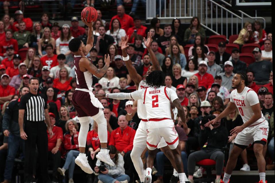 Jan 29, 2022; Lubbock, Texas, USA;  Mississippi State Bulldogs guard Shakeel Moore (3) shoots over Texas Tech Red Raiders forward Bryson Williams (11) in the first half at United Supermarkets Arena. Mandatory Credit: Michael C. Johnson-USA TODAY Sports