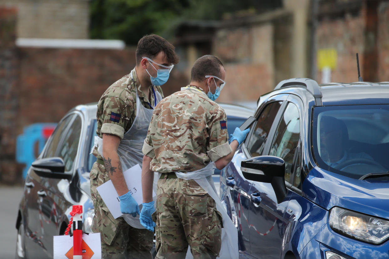 Soldiers help to conduct tests at a pop-up covid19 drive-through testing centre in Dalston, Hackney, east London, as the UK continues in lockdown to help curb the spread of the coronavirus. Picture date: Saturday May 2, 2020. 