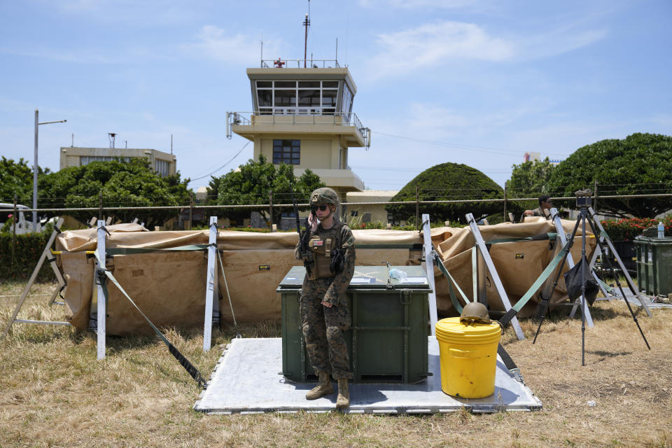 A U.S. soldier stands near the control tower at the Basco airport in Batanes province, northern Philippines on Monday, May 6, 2024. American and Filipino troopers are currently in the area to conduct annual combat-readiness exercises called Balikatan, Tagalog for shoulder-to-shoulder. (AP Photo/Aaron Favila)