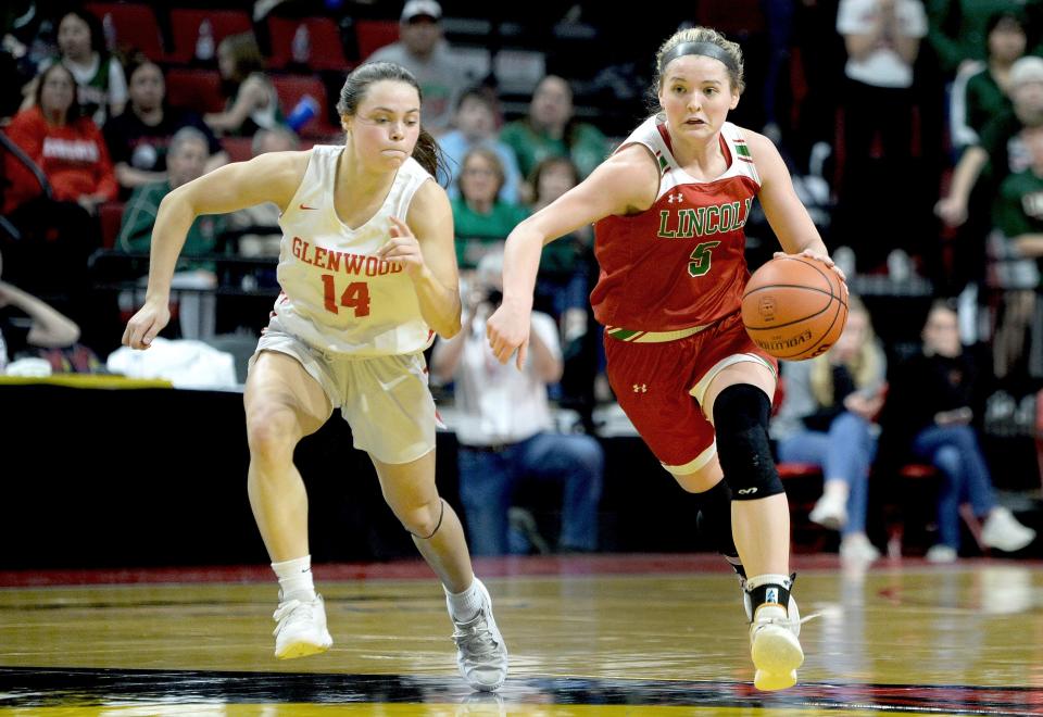 Lincoln's Kloe Froebe brings the ball downcourt during the Girls Class 3A Basketball State Championship at the CEFCU Arena Saturday, March 2, 2024.