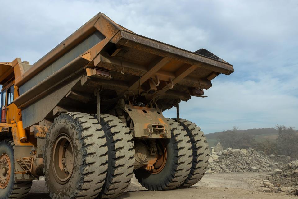 Glencore  Large mining dump truck. Transport industry. Extraction of stone in an open pit.