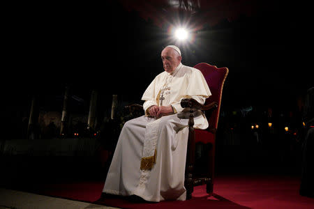 Pope Francis presides over the Via Crucis (Way of the Cross) torchlight procession on Good Friday, in front of Rome's Colosseum, in Rome, Italy Friday, April 19, 2019. Andrew Medichini/Pool via REUTERS