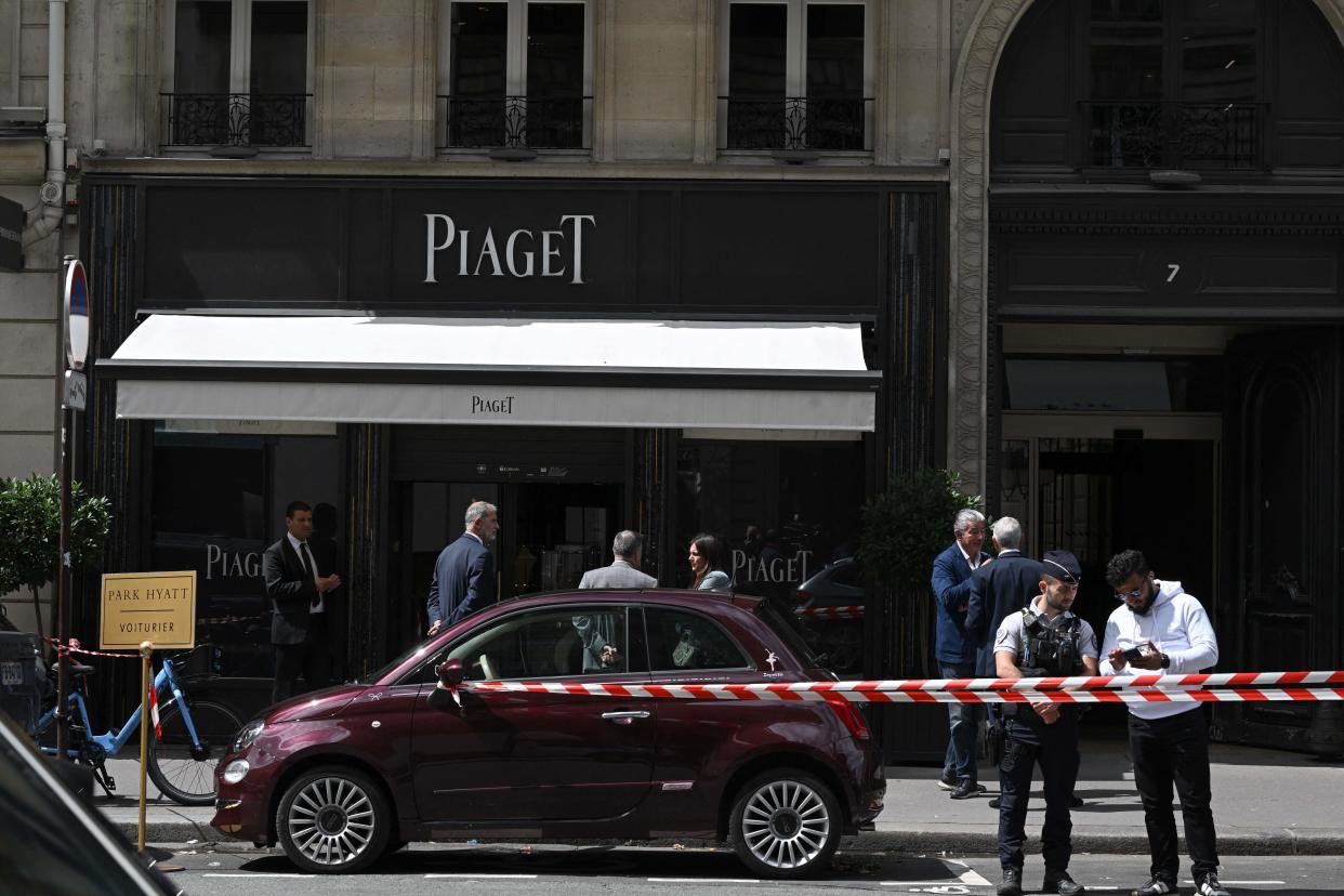 Red and white police tape cordons off the entrance of the French luxury Piaget jewelers store at Rue de la Paix that leads to Place Vendome, in Paris on August 1, 2023. / Credit: STEFANO RELLANDINI/AFP via Getty Images