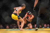 Jul 9, 2016; Las Vegas, NV, USA; Amanda Nunes (blue gloves) punches Miesha Tate (red gloves) during UFC 200 at T-Mobile Arena. Nunez won by rear naked choke. Mandatory Credit: Joshua Dahl-USA TODAY Sports