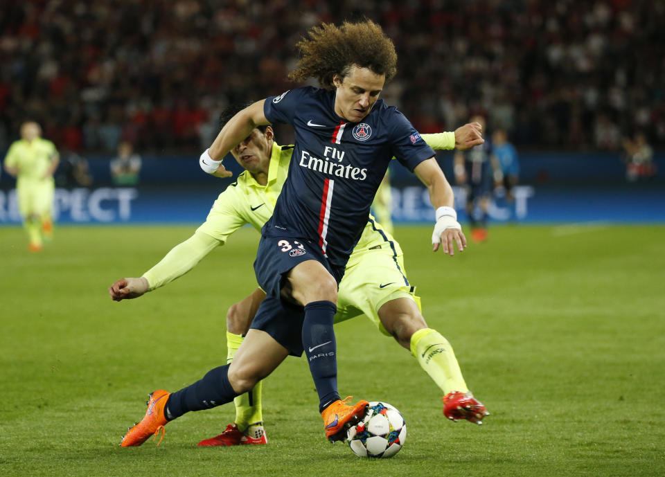 Football - Paris St Germain v FC Barcelona - UEFA Champions League Quarter Final First Leg - Parc des Princes, Paris, France - 15/4/15 Barcelona's Luis Suarez in action with PSG's David Luiz Reuters / Benoit Tessier