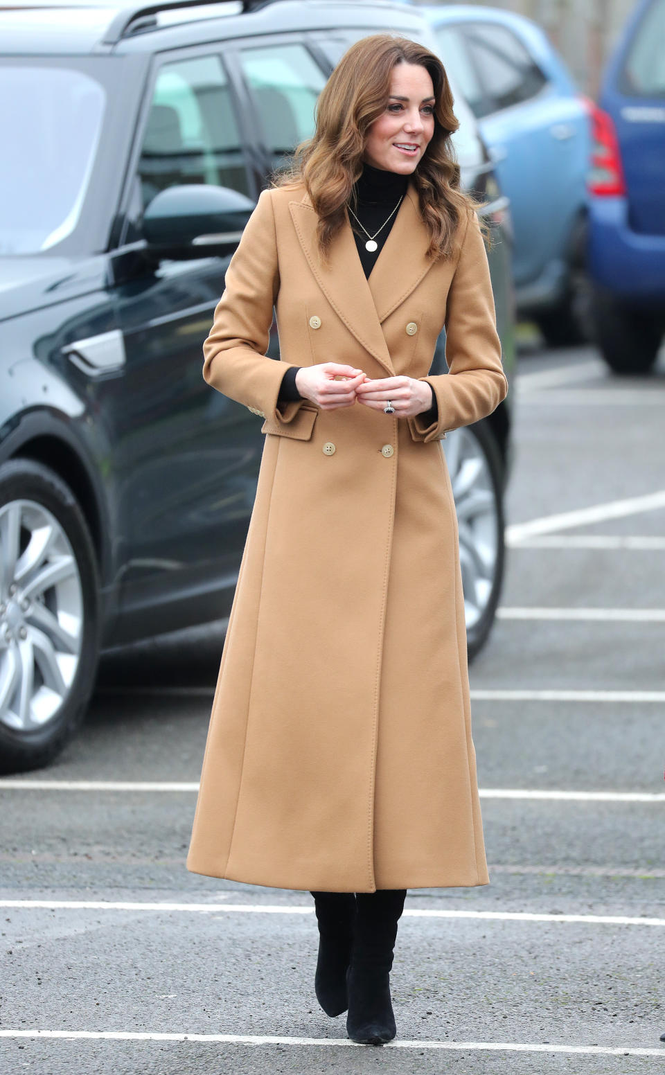 Duchess of Cambridge arrived wearing a camel coat by Massimo Dutti. [Photo: Getty]