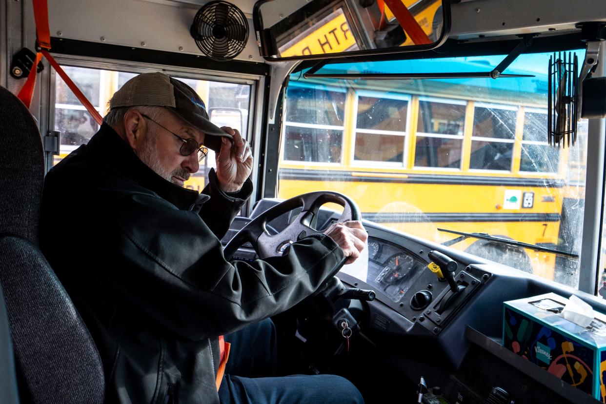 North Polk High School teacher Bruce Bennett drives his bus route after school on Wednesday, Feb. 7, 2024, in Alleman.