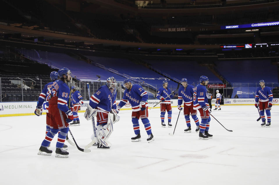 The New York Rangers leave the ice following a 4-0 loss to the New York Islanders in an NHL hockey game Thursday, Jan. 14, 2021, in New York. (Bruce Bennett/Pool Photo via AP)