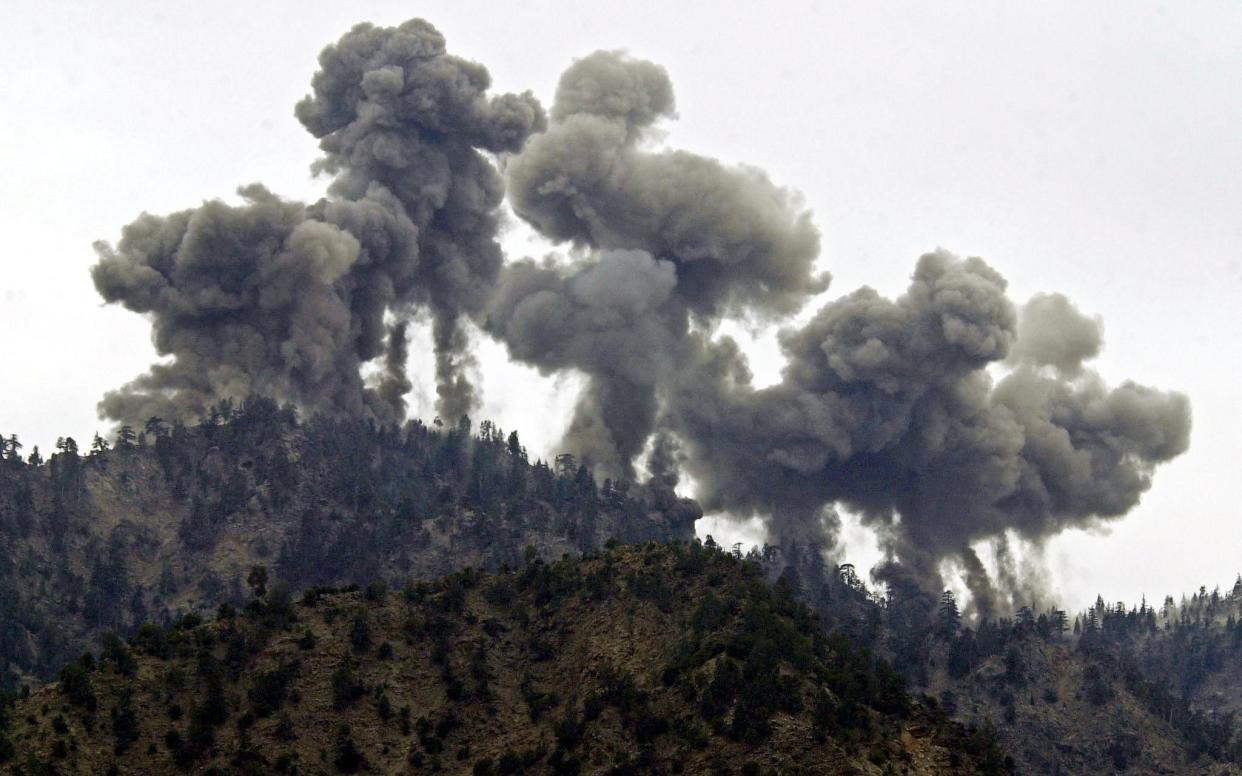 A multiple explosion rocks Al Qaeda positions in the Tora Bora mountains after an attack by US warplanes 14 December 2001 - EPA