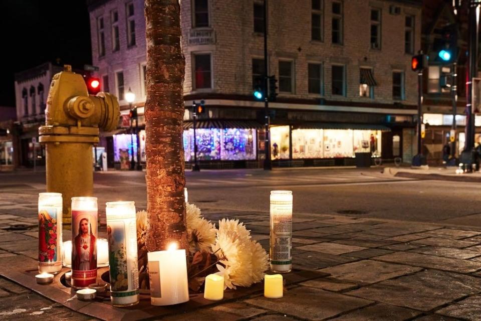 A makeshift memorial is pictured along the route of the parade on W Main Street in Waukesha, Wisconsin on November 22, 2021, the day after a vehicle drove through a Christmas parade killing five people