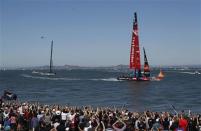 Emirates Team New Zealand crosses the finish line ahead of Oracle Team USA to win Race 11 of the 34th America's Cup yacht sailing race in San Francisco, California September 18, 2013. REUTERS/Stephen Lam