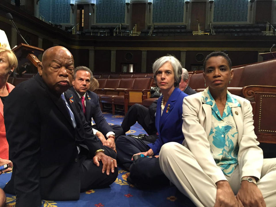 A photo tweeted from the floor of the U.S. House by Rep. Donna Edwards (R) shows Democratic members of the U.S. House of Representatives, including herself and Rep. John Lewis (L) staging a sit-in on the House floor "to demand action on common sense gun legislation" on Capitol Hill in Washington on June 22, 2016.  (Photo: Rep. Donna Edwards/Handout via Reuters)