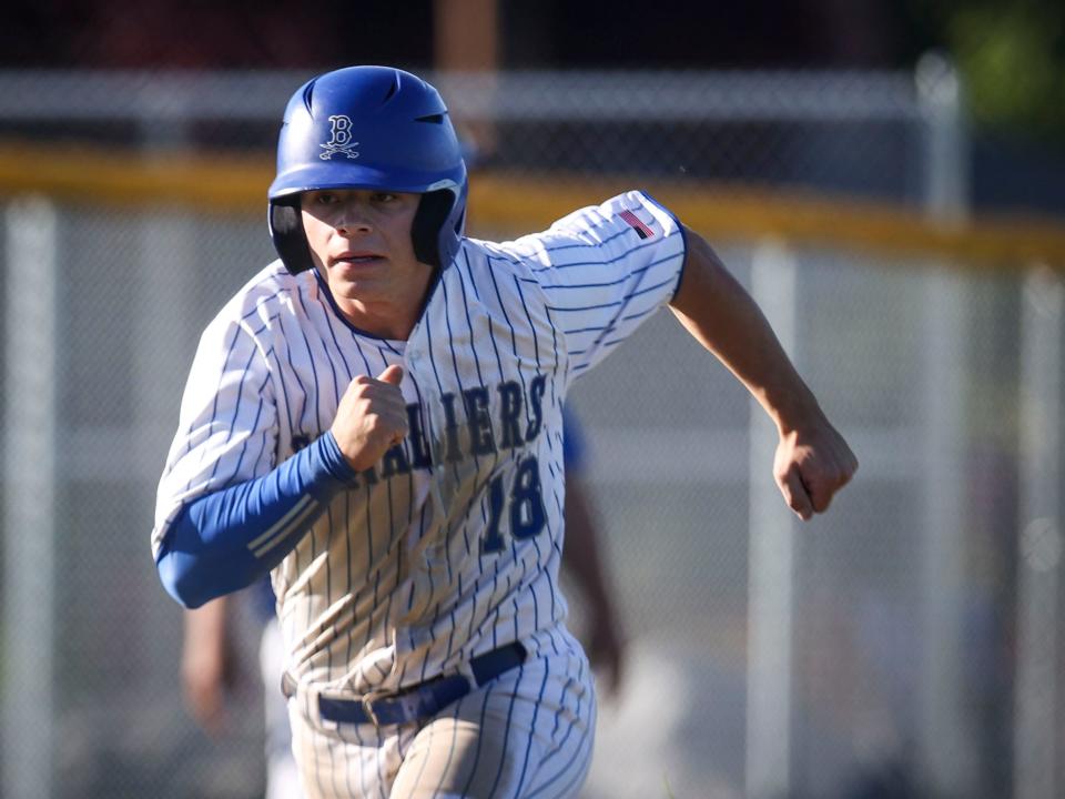 Blanchet Catholic's Griffen Mucken (18) runs toward home plate during the game against Kennedy on Wednesday, May 8, 2024 in Salem, Ore.