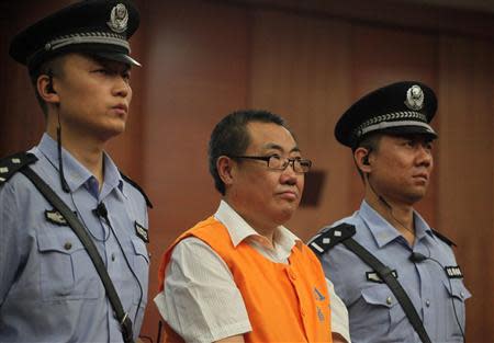 Yang Dacai, a former provincial official, listens to a verdict at a court in Xi'an, Shaanxi province, September 5, 2013. REUTERS/Stringer