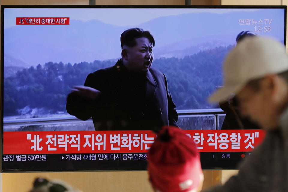 People watch a TV news program reporting North Korea's announcement with a file footage of North Korean leader Kim Jong Un, at the Seoul Railway Station in Seoul, South Korea, Sunday, Dec. 8, 2019. North Korea said Sunday it carried out a “very important test” at its long-range rocket launch site that U.S. and South Korean officials said the North had partially dismantled as part of denuclearization steps. The letters, top left, read "North. Very important test." (AP Photo/Lee Jin-man)