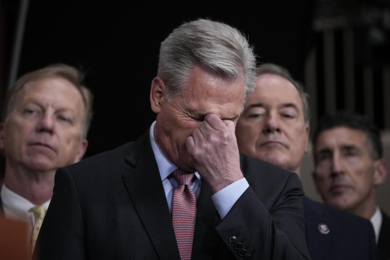 Kevin McCarthy pinches the bridge of his nose.