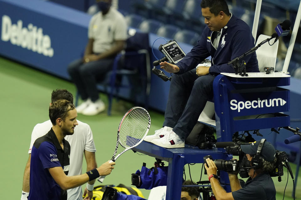 Daniil Medvedev, of Russia, left, taps the shoe of the referee after winning his match with Federico Delbonis, of Argentina, during the first round of the U.S. Open tennis championships, Tuesday, Sept. 1, 2020, in New York. (AP Photo/Frank Franklin II)