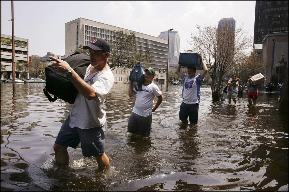 Survivors of Hurricane Katrina evacuate their homes on Sept. 3, 2005. (Photo: Laurent Van der Stockt/Gamma-Rapho via Getty Images)