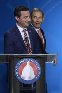  U.S. Rep. John Curtis, rear, looks on after reacting to a statement made from Trent Staggs, left, following the Utah Senate primary debate for Republican contenders battling to win the seat of retiring U.S. Sen. Mitt Romney Monday, June 10, 2024, in Salt Lake City. (Pool photo by Rick Bowmer/AP)