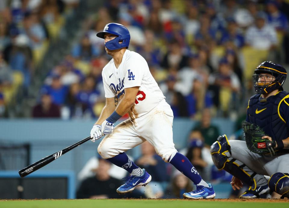 LOS ANGELES, CALIFORNIA - AUGUST 17:  Austin Barnes #15 of the Los Angeles Dodgers hits a home run against the Milwaukee Brewers in the eighth inning at Dodger Stadium on August 17, 2023 in Los Angeles, California. (Photo by Ronald Martinez/Getty Images)