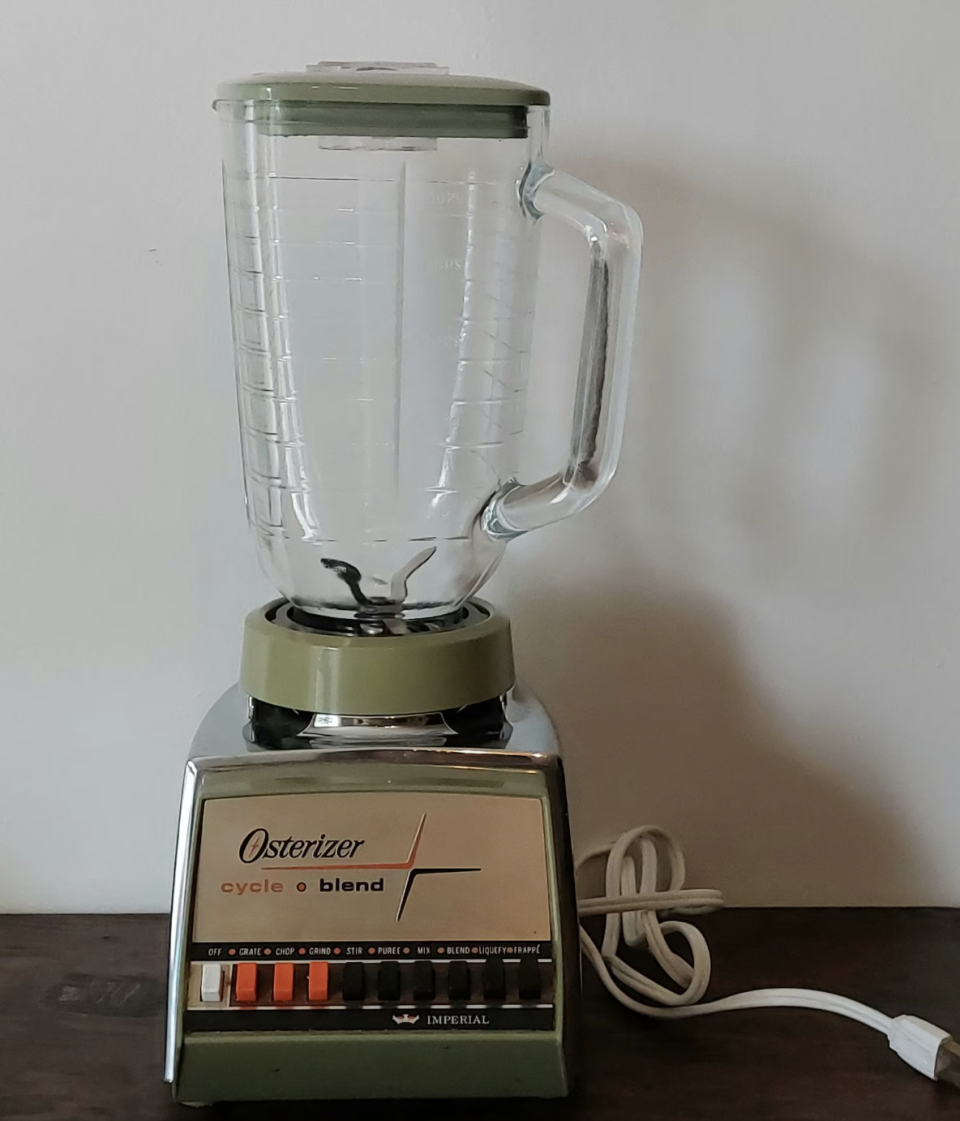 Osterizer Classic Vintage Blender with a glass jar and various speed settings. The brand name "Osterizer" and the model "cycle blend" are clearly visible