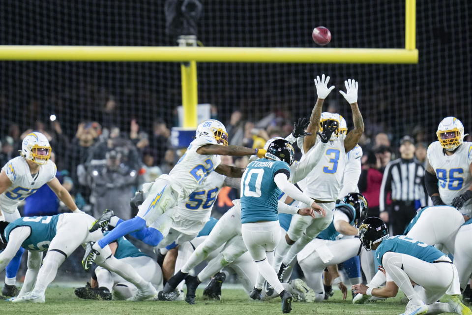 Jacksonville Jaguars place kicker Riley Patterson (10) kicks the game-winning field goal against the Los Angeles Chargers during the second half of an NFL wild-card football game, Saturday, Jan. 14, 2023, in Jacksonville, Fla. Jacksonville Jaguars won 31-30. (AP Photo/John Raoux)