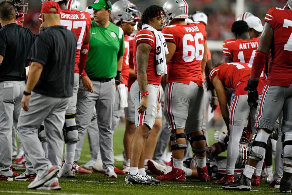 Injured Ohio State receiver Jaxon Smith-Njigba walks out of the huddle during Saturday's game against Notre Dame.