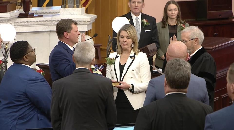 Rep. Jason Stephens  is sworn in as House Speaker on on Jan. 3, 2023. House Minority Leader Allison Russo held the Bible when he was sworn in.