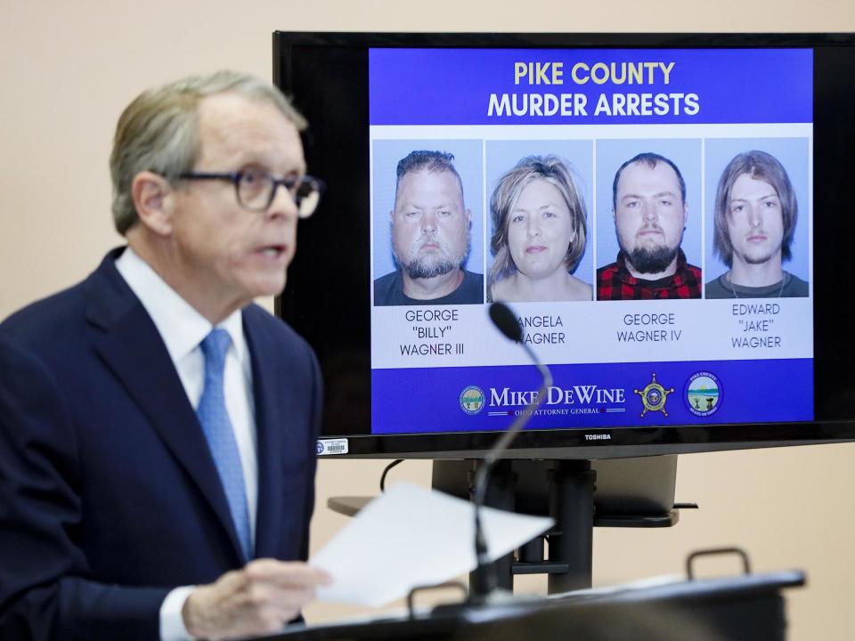 Ohio Attorney General Mike DeWine speaks alongside a display of those arrested during a news conference: AP Photo/John Minchillo