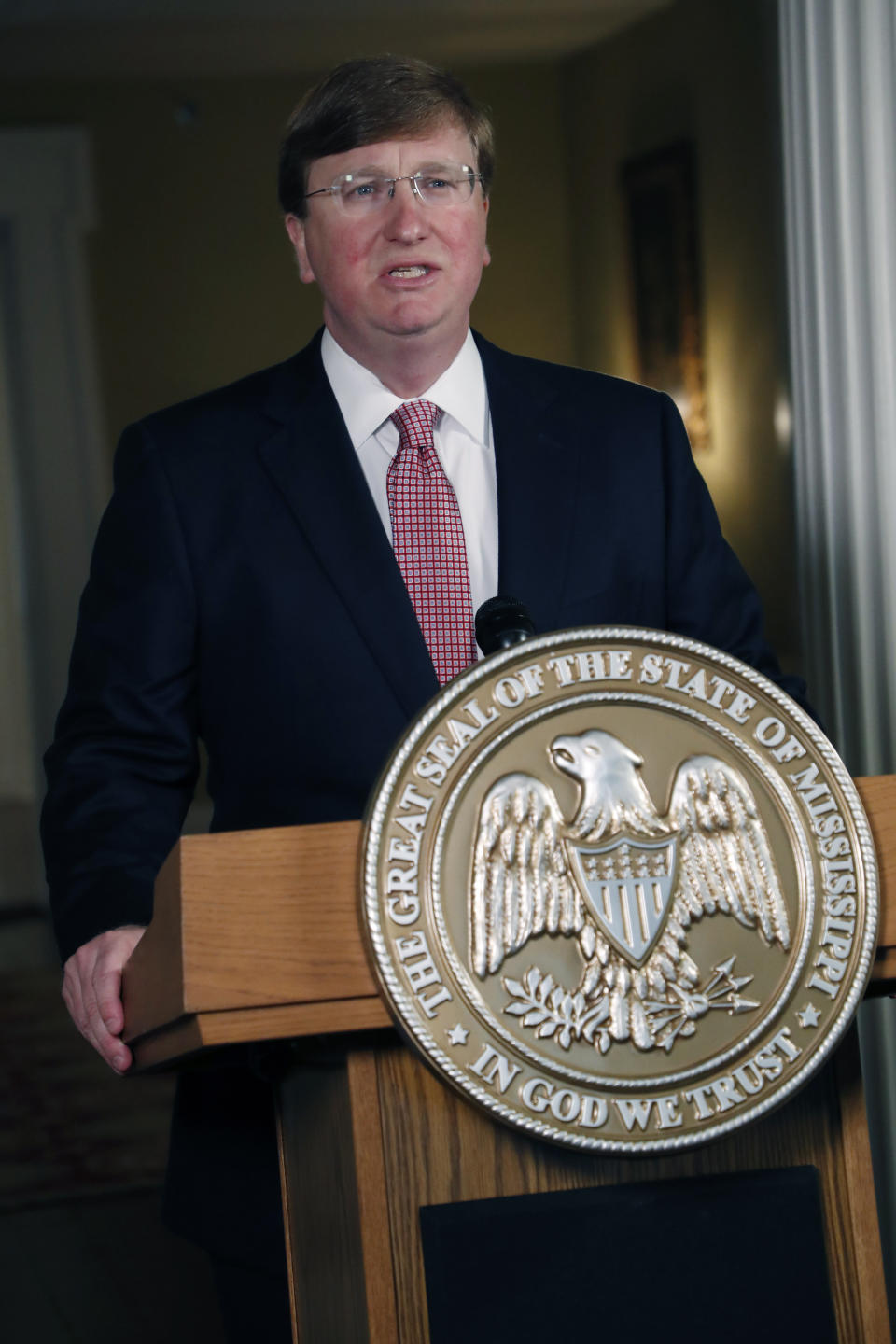 Mississippi Republican Gov. Tate Reeves delivers a televised address prior to signing a bill retiring the last state flag in the United States with the Confederate battle emblem, at the Governor's Mansion in Jackson, Miss., Tuesday, June 30, 2020. The legislation passed both chambers of the Legislature on Sunday. (AP Photo/Rogelio V. Solis, Pool)