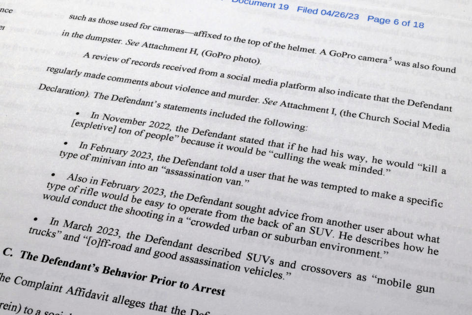 The Justice Department motion for continued pretrial detention of Jack Teixeira is photographed Thursday, April 27, 2023. A judge has put off a decision on whether the Massachusetts Air National guardsman accused of leaking highly classified military documents should be held in jail until his trial. Prosecutors said Teixeira kept an arsenal of weapons and said on social media that he would like to kill a "ton of people." (AP Photo/Jon Elswick)