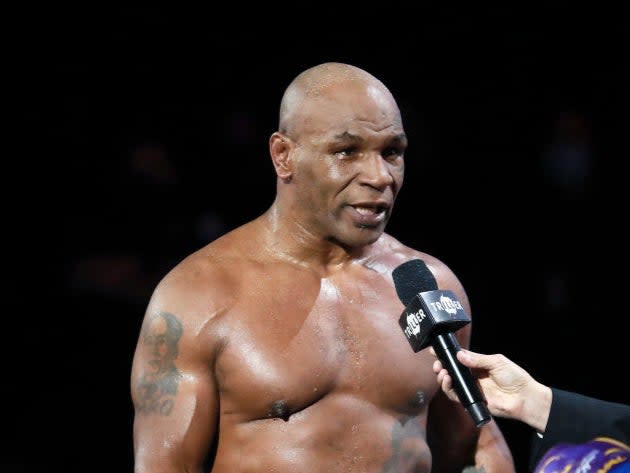 Mike Tyson reacts after receiving a split draw against Roy Jones Jr (Getty)
