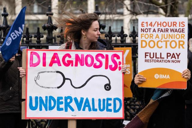 13 March 2023: Demonstrators take part in a protest by junior doctors, amid a dispute with the government over pay, outside of Saint Thomas Hospital, in London (AFP/Getty)