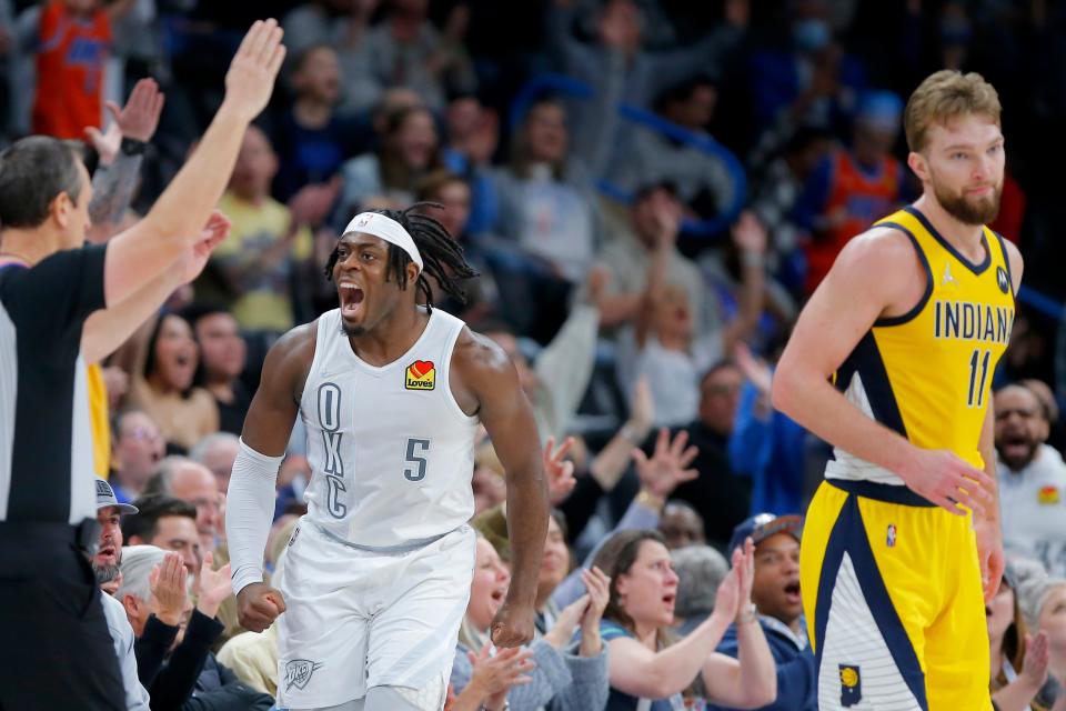 Oklahoma City Thunder forward Luguentz Dort (5) celebrates beside Indiana Pacers forward Domantas Sabonis (11) after making a 3-pointer during an NBA basketball game between the Oklahoma City Thunder and the Indiana Pacers at Paycom Center in Oklahoma City, Friday, Jan. 28, 2022. The Pacers won 113-110 in overtime. 