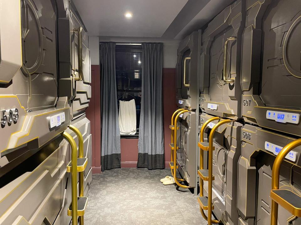 A row of capsule beds at The Capsule Hotel in Sydney, Australia.