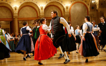 Dancers dressed in Tracht (traditional costumes) perform during the opening of the traditional Kathreintanz in Vienna, Austria, November 26, 2016. Picture taken November 26, 2016. REUTERS/Leonhard Foeger