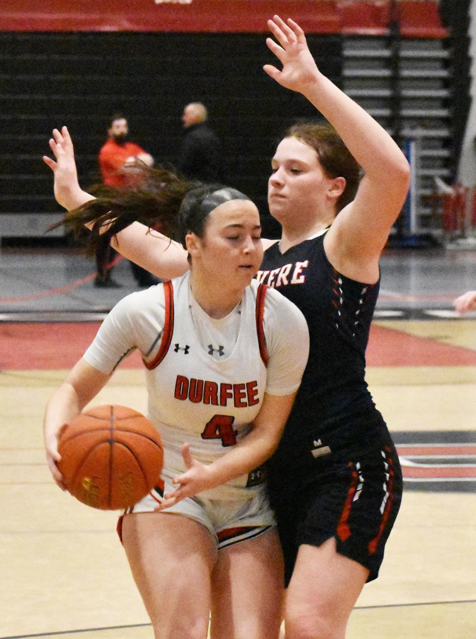 Durfee's Julia Hargraves drives on Revere's Bella Stamatopoulos during Tuesday's Division I preliminary contest at B.M.C. Durfee High School in Fall River Feb. 27, 2024.
(Credit: COLIN FURZE)