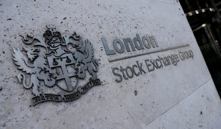 FILE PHOTO: Signage is seen outside the entrance of the London Stock Exchange in London