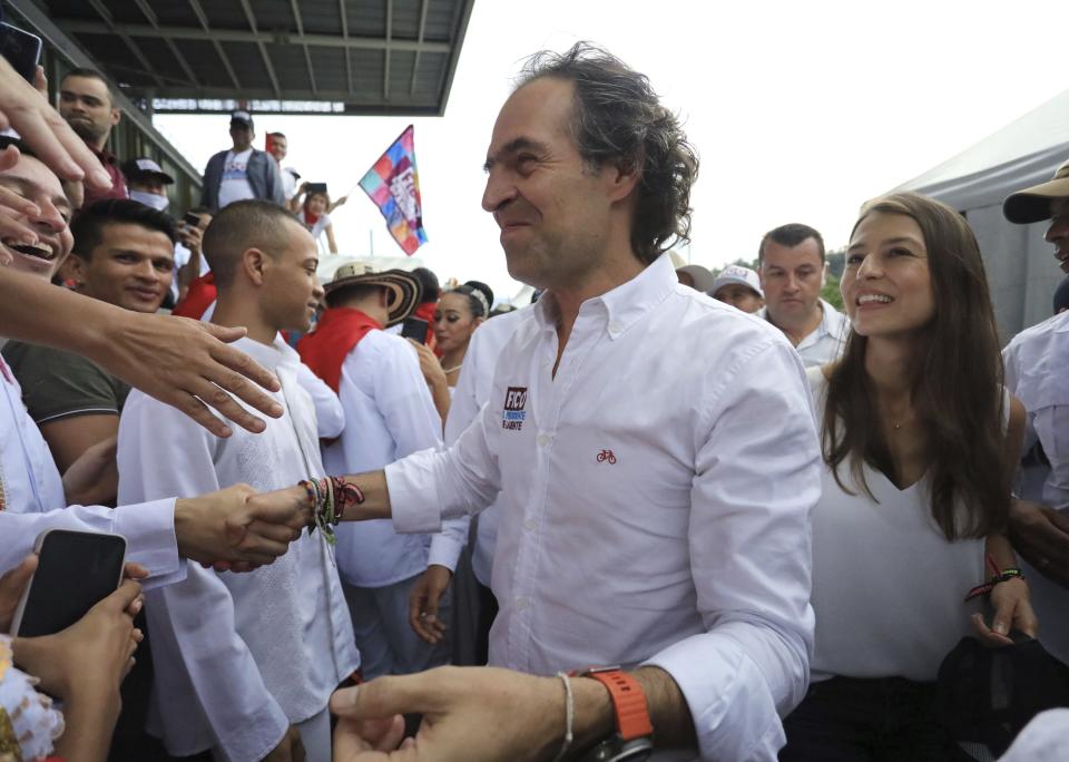 Federico Gutierrez, presidential candidate representing the Team for Colombia coalition, greets his supporters during a closing campaign rally in Medellin, Colombia, Sunday, May 22, 2022. Elections are set for May 29. (AP Photo/Jaime Saldarriaga)