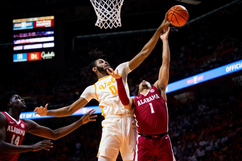 Tennessee forward Jonas Aidoo blocks a shot by Alabama guard Mark Sears (1) during the Vols' 68-59 win at Thompson-Boling Arena on Feb. 15, 2023.