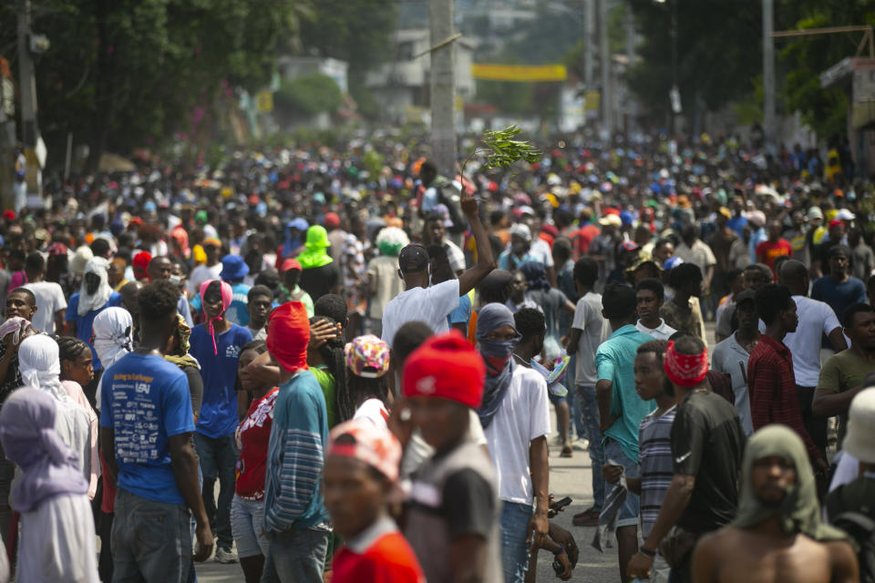 Demonstrators fill the streets during a protest to demand the resignation of Prime Minister Ariel Henry, in the Petion-Ville area of Port-au-Prince, Haiti, Monday, Oct. 3, 2022. (AP Photo/Odelyn Joseph)