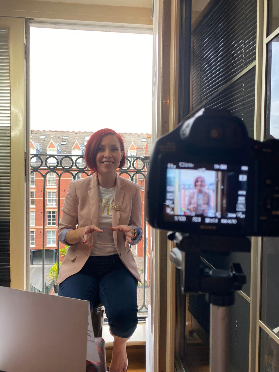 Elise Clayton filming for YouTube. She left her 20-year career in marketing to retrain as a clinical hypnotherapist and transformational coach. (Supplied)