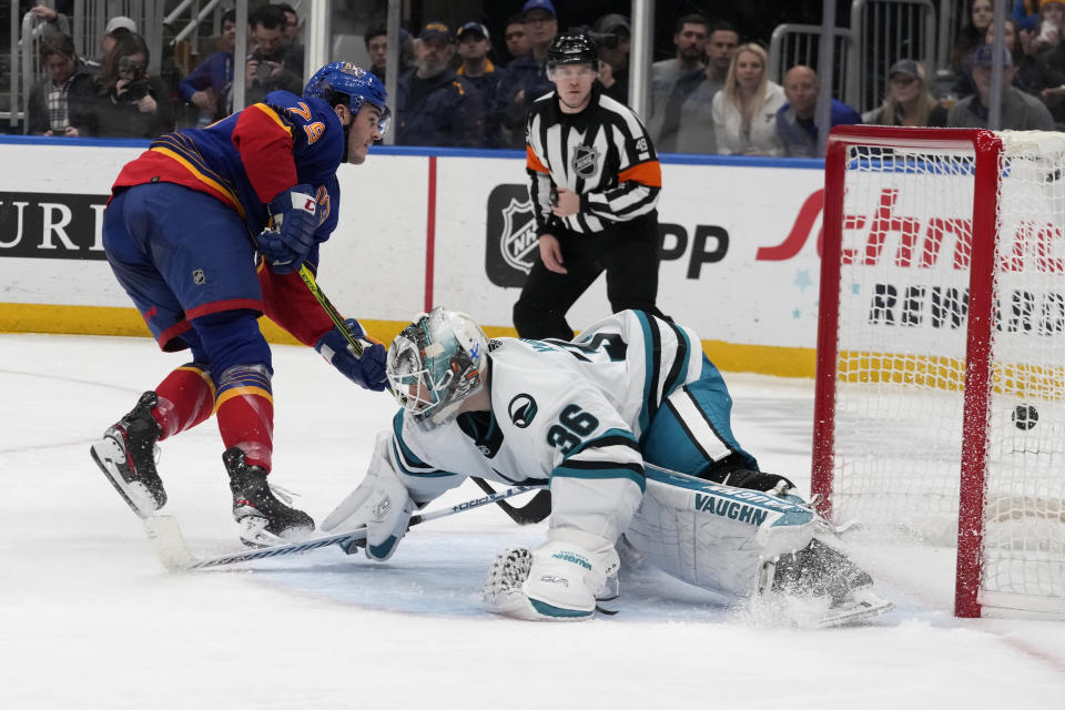 St. Louis Blues' Sammy Blais, left, scores past San Jose Sharks goaltender Kaapo Kahkonen (36) during the second period of an NHL hockey game Thursday, March 9, 2023, in St. Louis. (AP Photo/Jeff Roberson)